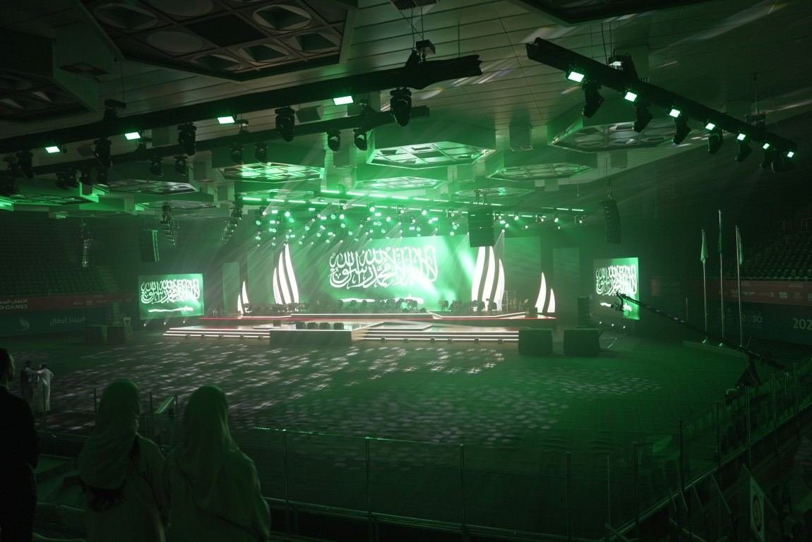 Green-lit stage production at night